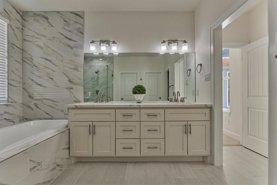 You'll love the dual vanity space and luxe appointments throughout the owner's retreat bathroom. You'll love the dual vanity space and luxe appointments throughout the owner's retreat bathroom.