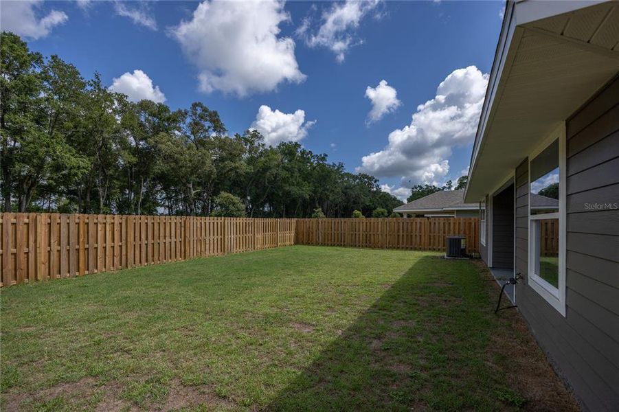 Front exterior of a new home in Savannah Station, Alachua, FL, highlighting curb appeal (Image 1).