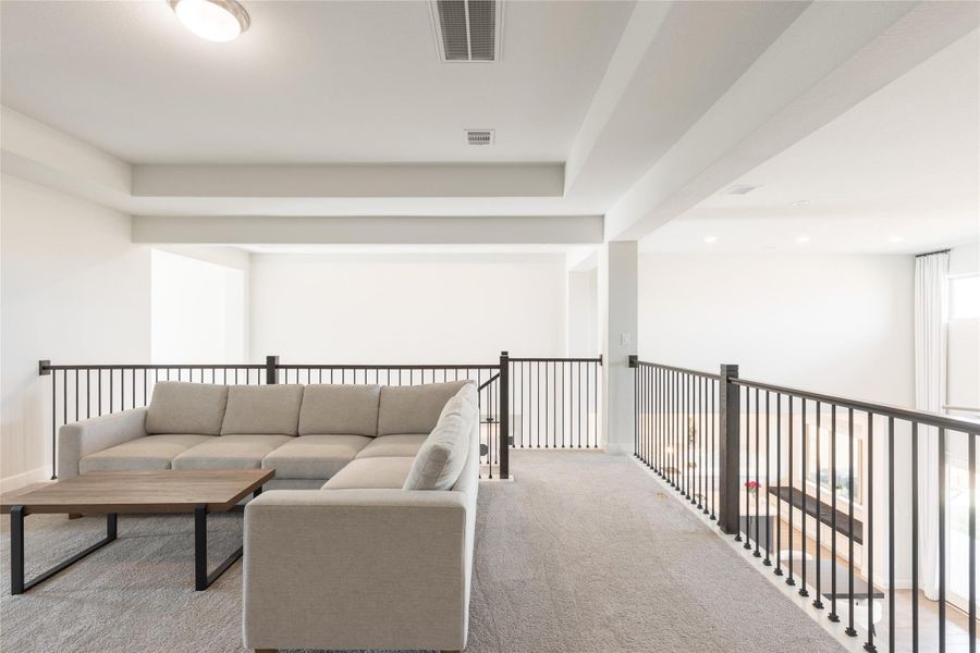 Open loft overlooking staircase With Tray Cielings