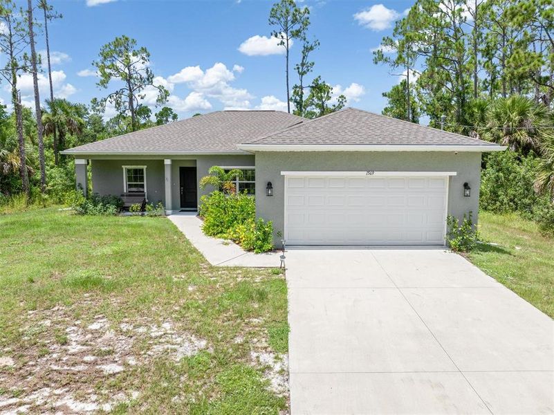 Front exterior of a new home in , North Port, FL, highlighting curb appeal (Image 24).