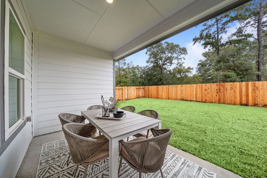A table and chairs outside. A table and chairs outside.