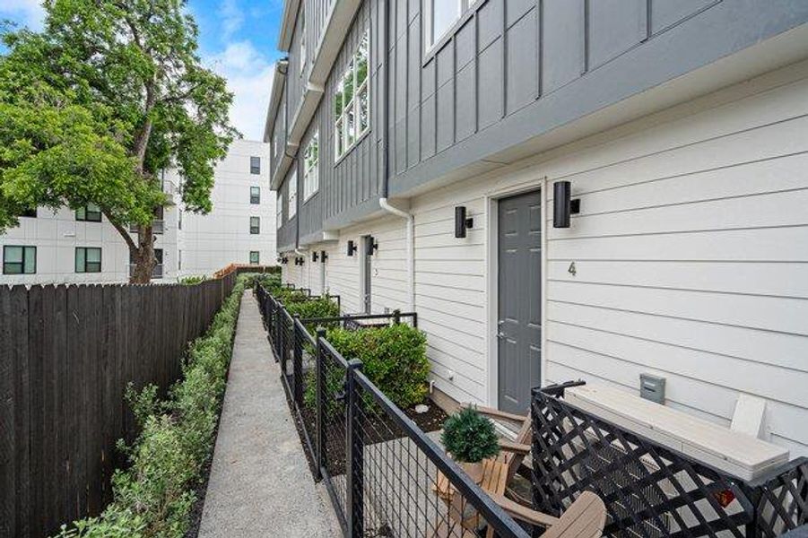 Exterior details and patio area of a home in Bluebonnet Lofts, Austin (Image 2). Exterior details and patio area of a home in Bluebonnet Lofts, Austin (Image 2).