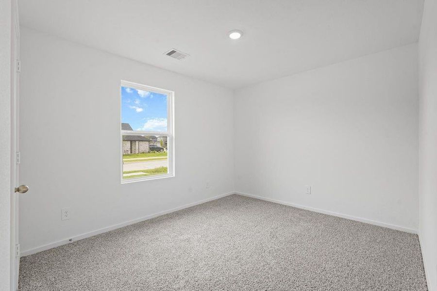 Spacious, unfurnished interior of a new home in Sunterra, Katy (Image 4).