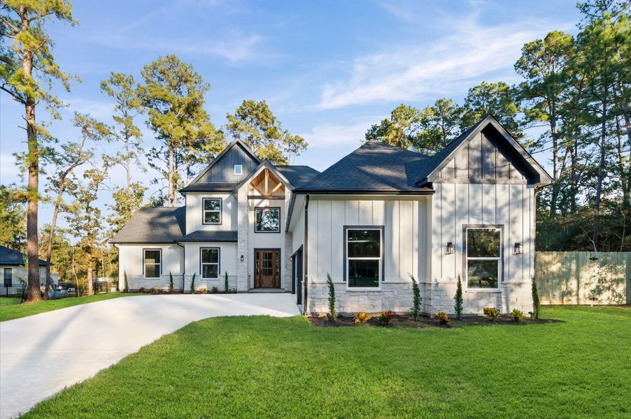Front exterior of a new home in , Magnolia, TX, highlighting curb appeal (Image 2).
