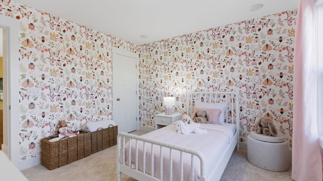 Elegant bedroom retreat featuring soft carpet and oversized windows that create a bright, welcoming space in Greenville, SC