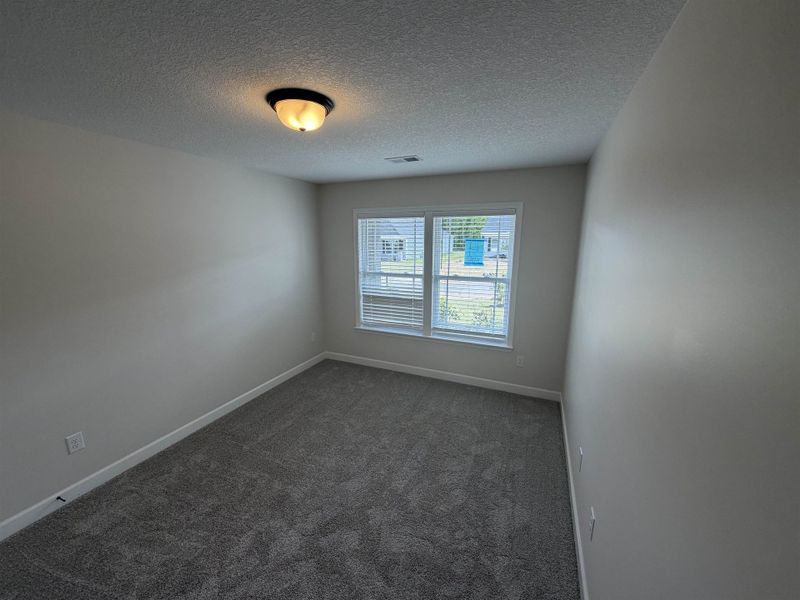 Spacious, unfurnished interior of a new home in Stones Throw, Inman (Image 14).