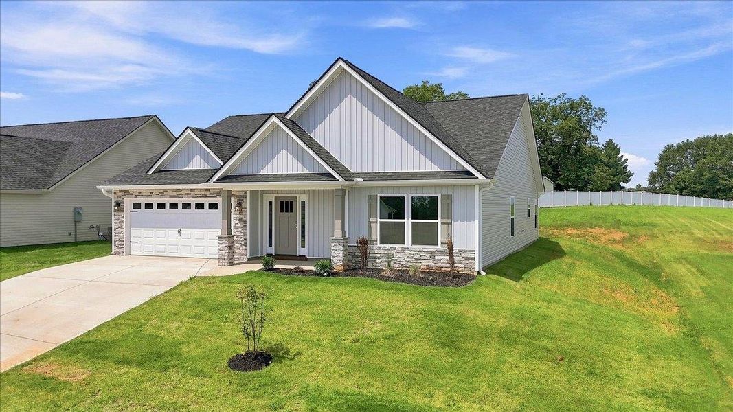 Front exterior of a new home in Davis Heights, Inman, SC, highlighting curb appeal (Image 2). Front exterior of a new home in Davis Heights, Inman, SC, highlighting curb appeal (Image 2).