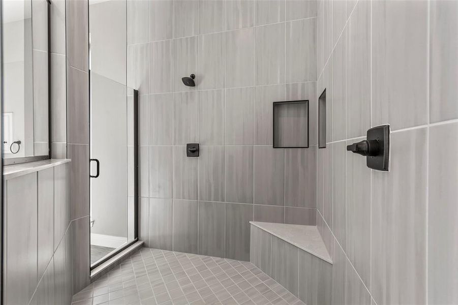 Bathroom with a shower with shower door