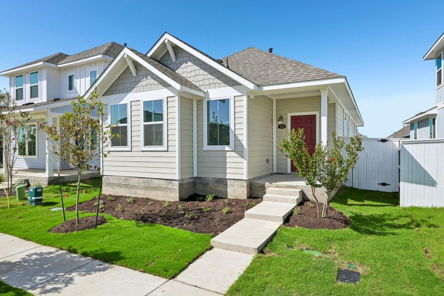 Front exterior of a new home in Harvest Ridge, Elgin, TX, highlighting curb appeal (Image 16).