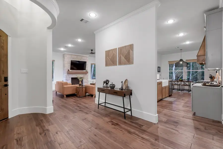 Open floor plan with tall ceilings, ample lighting and large windows.