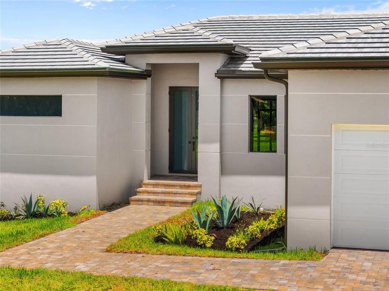 Front exterior of a new home in , Punta Gorda, FL, highlighting curb appeal (Image 30).