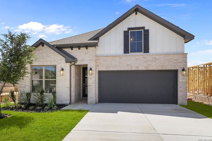 Front exterior of a new home in Davis Ranch, San Antonio, TX, highlighting curb appeal (Image 28).