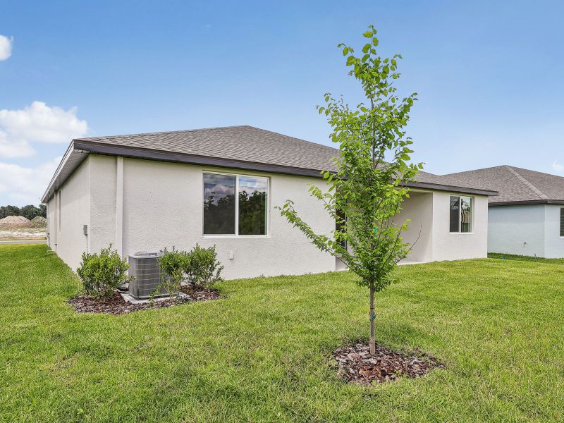 Exterior details and patio area of a home in The Grove at Stuart Crossing - Signature Series, Bartow (Image 3). Exterior details and patio area of a home in The Grove at Stuart Crossing - Signature Series, Bartow (Image 3).