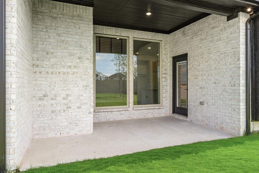 Front exterior of a new home in Painted Tree Woodland District 50, McKinney, TX, highlighting curb appeal (Image 27). Front exterior of a new home in Painted Tree Woodland District 50, McKinney, TX, highlighting curb appeal (Image 27).