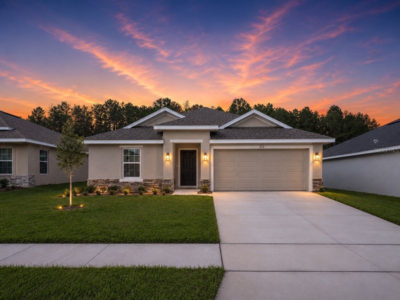 Front exterior of a new home in Arbor Park, Leesburg, FL, highlighting curb appeal (Image 1). Front exterior of a new home in Arbor Park, Leesburg, FL, highlighting curb appeal (Image 1).