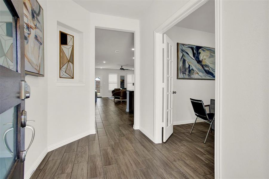 Hallway featuring dark wood-type flooring