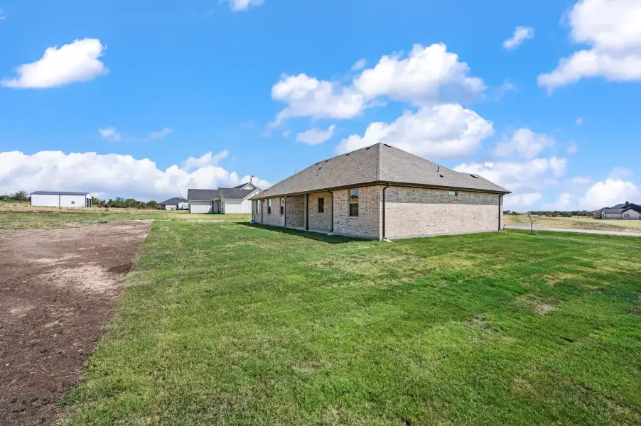 Exterior details and patio area of a home in Gatlin Ranch, Springtown (Image 22).