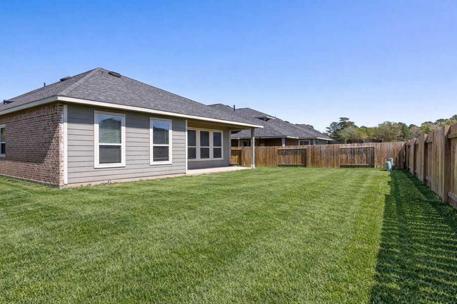 Exterior details and patio area of a home in Mill Creek Trails, Magnolia (Image 3).