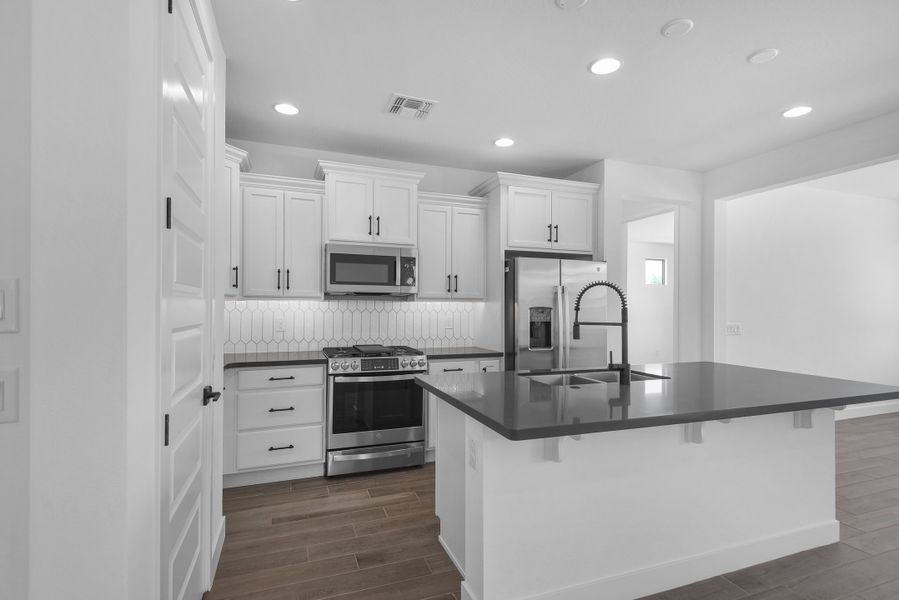 Furnished interior view inside a new home in CantaMia at Estrella 55+, Goodyear (Image 16).