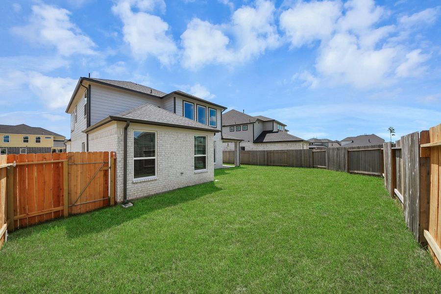 Backyard retreat, offering an abundance of space for kids to play and explore. The possibilities are endless in this outdoor haven, where the joy of open-air activities and family gatherings awaits.