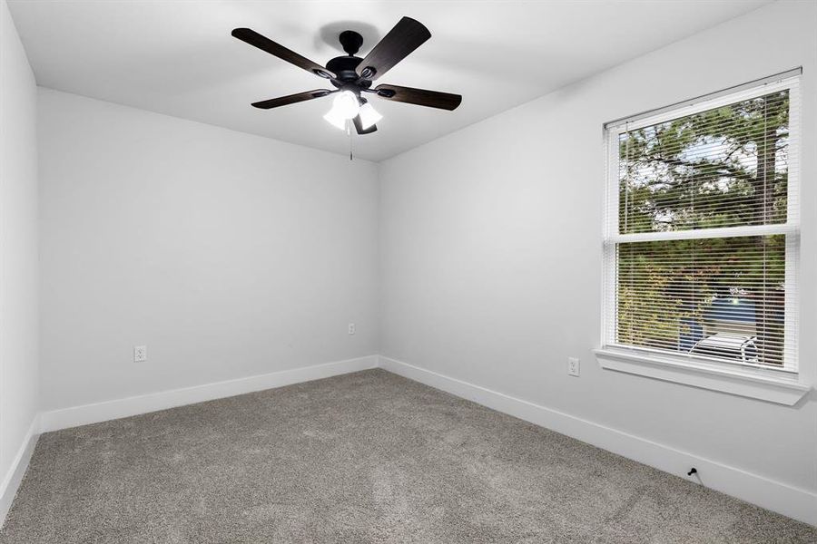 Unfurnished room with carpet flooring and ceiling fan