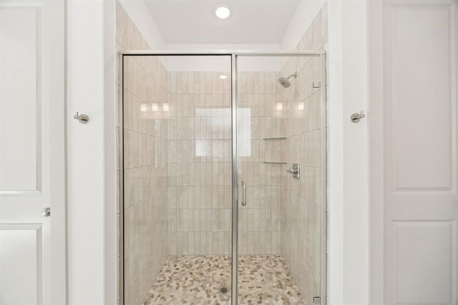 You'll enjoy starting or ending your day in this spacious walk in owner's bath shower!