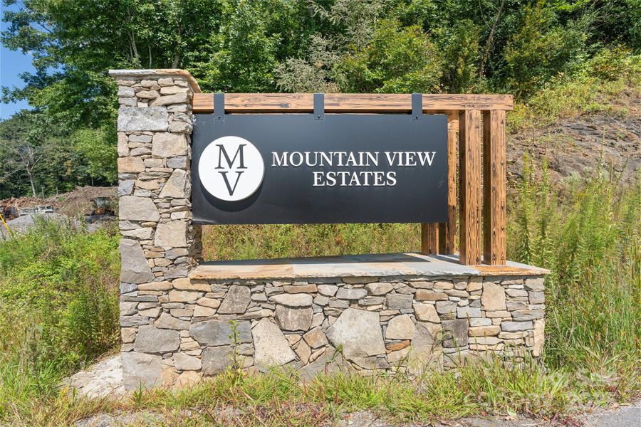 Front exterior of a new home in , Waynesville, NC, highlighting curb appeal (Image 14).