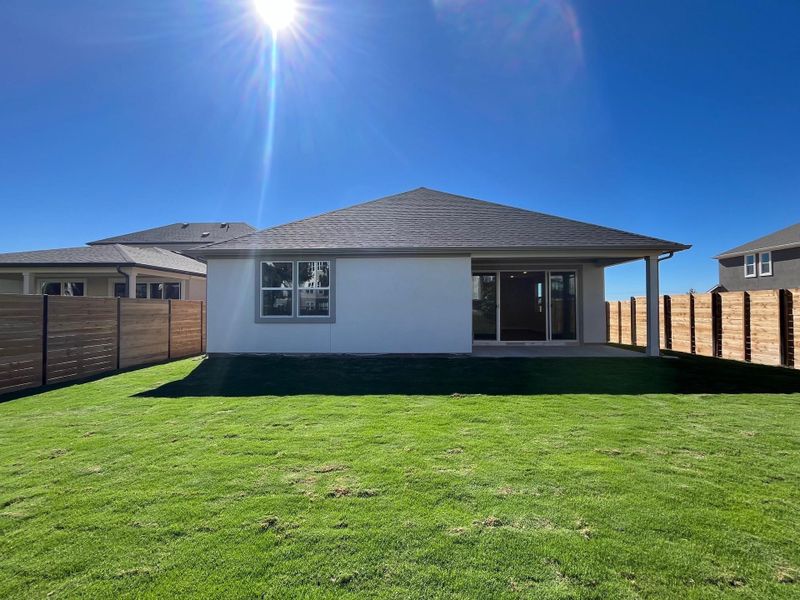 Rear of Home with Covered Patio and Private Backyard