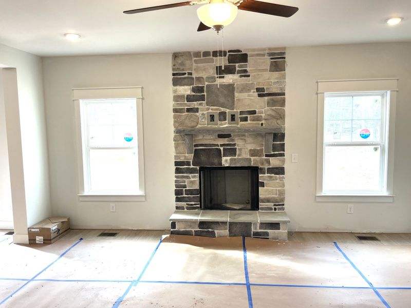 Great room with stone gas fireplace.