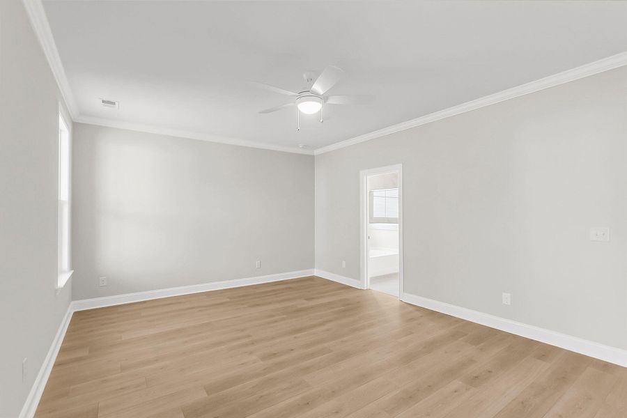 Spacious, unfurnished interior of a new home in Tidewater at Lakes of Cane Bay, Summerville (Image 37).