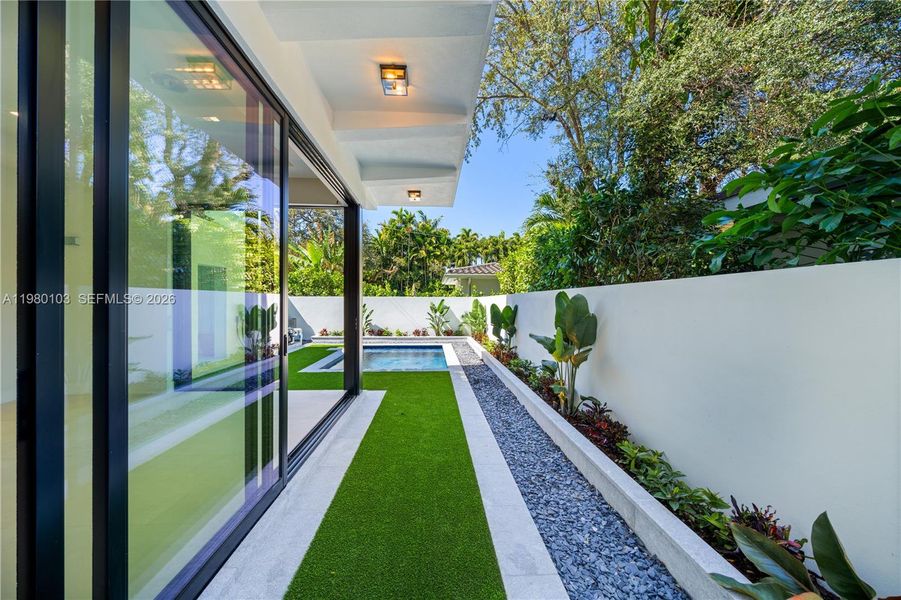 Exterior details and patio area of a home in , Coral Gables (Image 27).