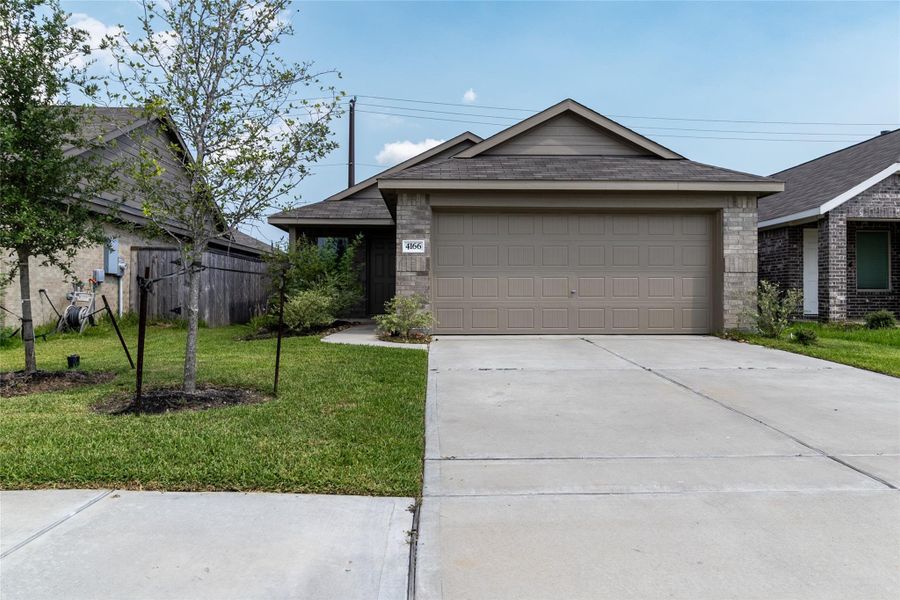 Front exterior of a new home in Burnet Fields at Baytown Crossings, Baytown, TX, highlighting curb appeal (Image 18). Front exterior of a new home in Burnet Fields at Baytown Crossings, Baytown, TX, highlighting curb appeal (Image 18).