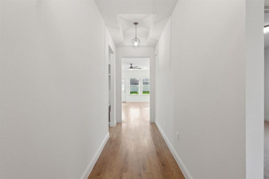 Corridor featuring wood-type flooring