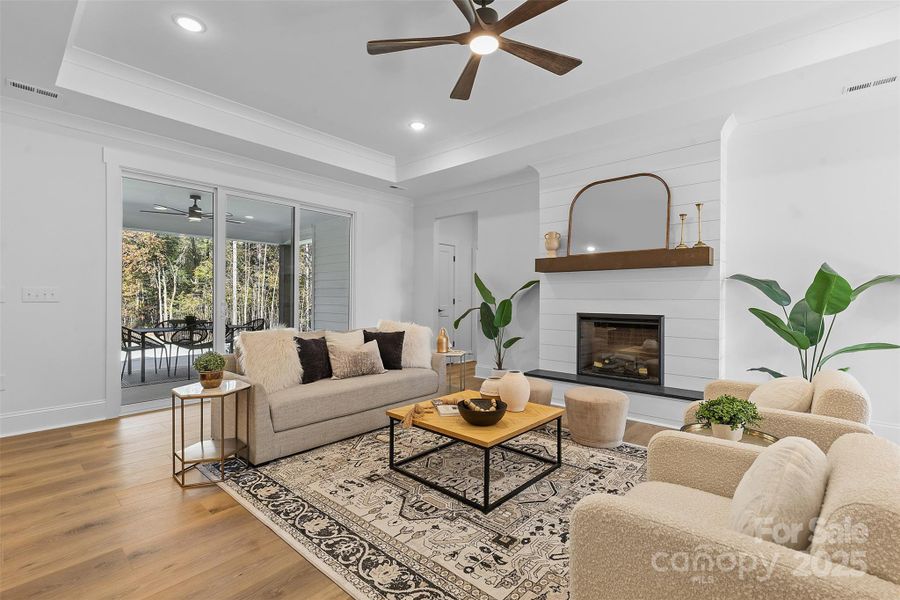 *representative photo- family room w/ tray ceiling, shiplap fireplace & cedar mantle!