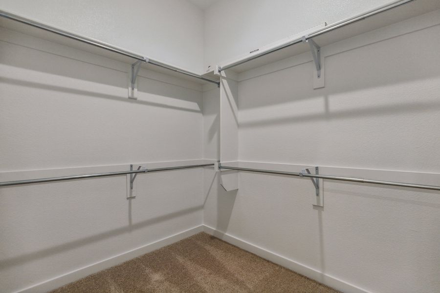 Primary Closet in the Birch home plan by Trophy Signature Homes – REPRESENTATIVE PHOTO