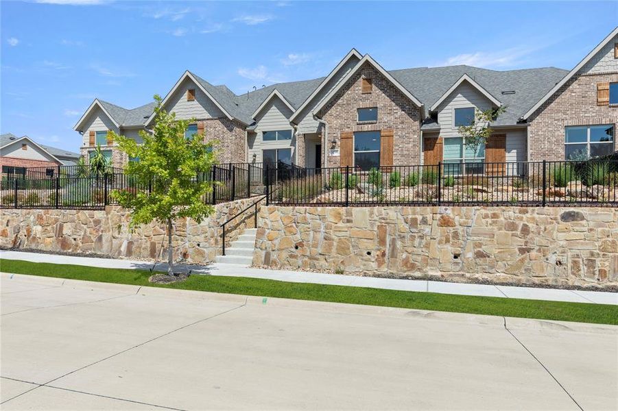 Front exterior of a new home in Cottonwood Creek, Wylie, TX, highlighting curb appeal (Image 1).