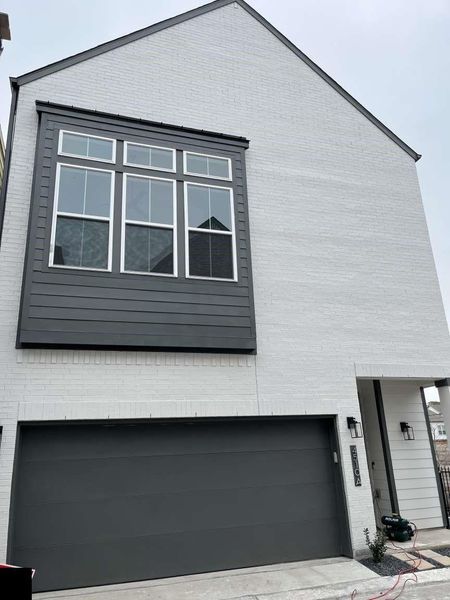 Front exterior of a new home in , Houston, TX, highlighting curb appeal (Image 1). Front exterior of a new home in , Houston, TX, highlighting curb appeal (Image 1).