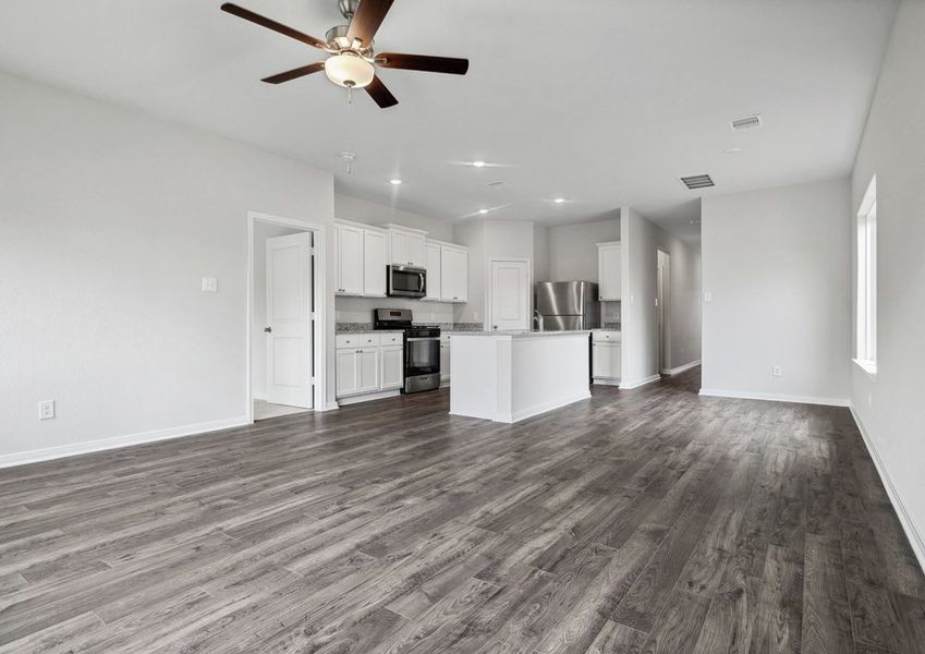 Kitchen and dining room flow into the family room Kitchen and dining room flow into the family room