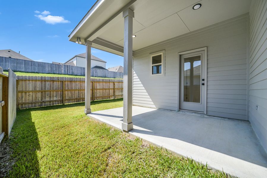Exterior details and patio area of a home in Mostyn Springs, Magnolia (Image 4).
