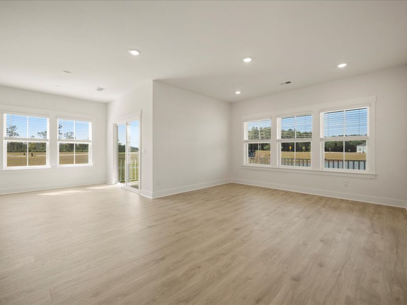 Spacious, unfurnished interior of a new home in The Coves at Lakes of Cane Bay, Summerville (Image 26).