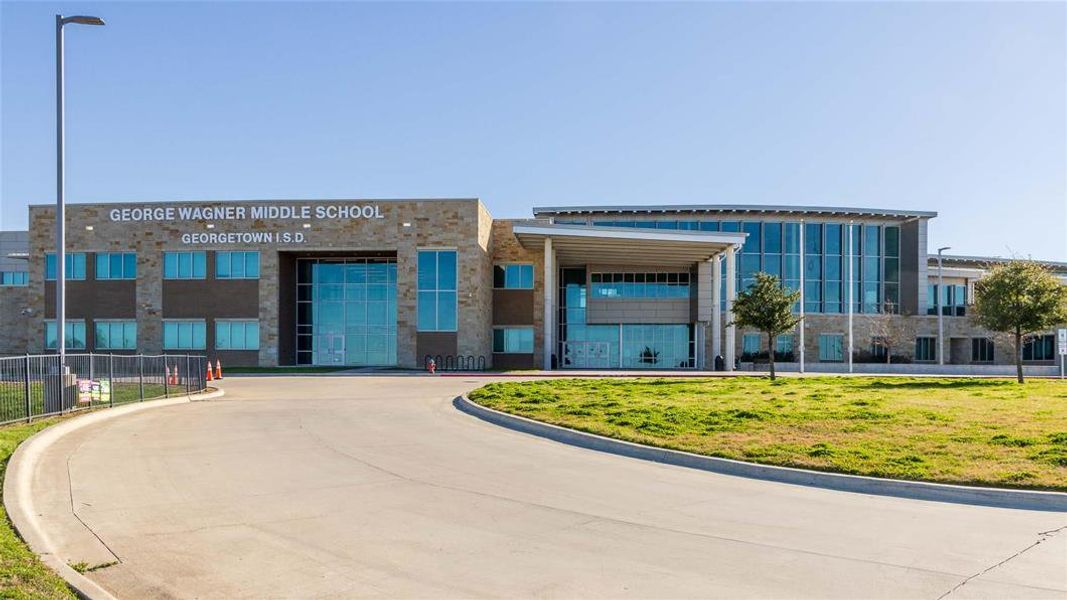 View of building exterior featuring fence