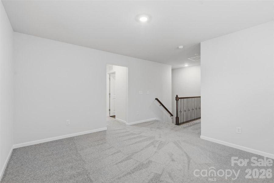 Spacious, unfurnished interior of a new home in Redhawk: Enclave, Belmont (Image 31).