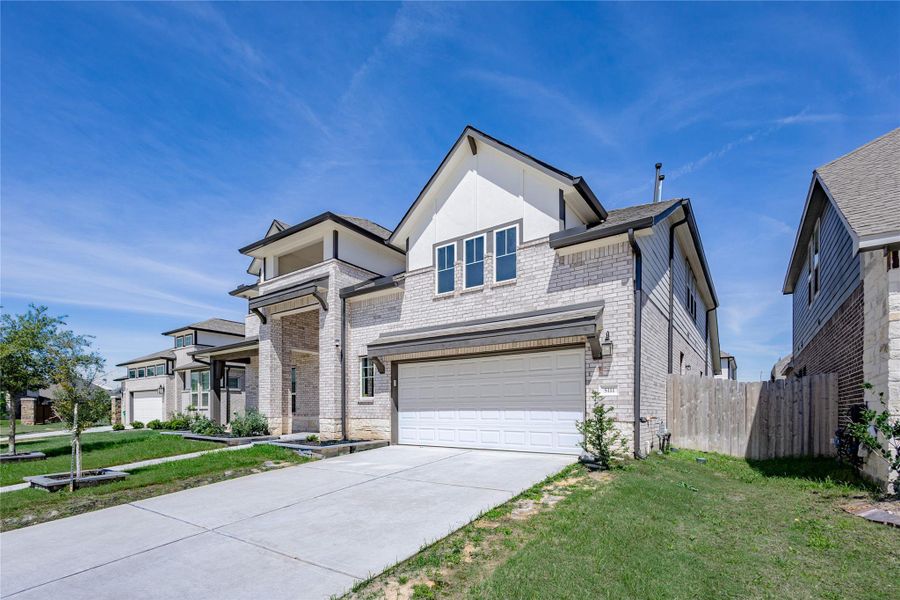 Front exterior of a new home in , Richmond, TX, highlighting curb appeal (Image 24).