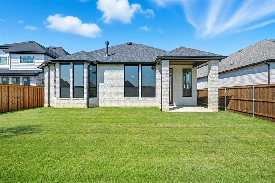 Front exterior of a new home in Trinity Falls, McKinney, TX, highlighting curb appeal (Image 1).