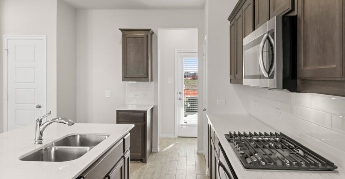 Representative exterior photo of a completed home built from the Whitney by Impression Homes in Creekshaw, Royse City, TX (Image 6). Representative exterior photo of a completed home built from the Whitney by Impression Homes in Creekshaw, Royse City, TX (Image 6).