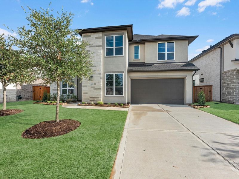 Front exterior of a new home in Trillium, Richmond, TX, highlighting curb appeal (Image 2). Front exterior of a new home in Trillium, Richmond, TX, highlighting curb appeal (Image 2).