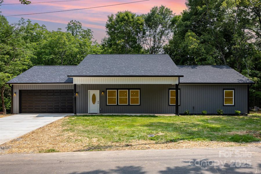 Front exterior of a new home in , Lincolnton, NC, highlighting curb appeal (Image 1).