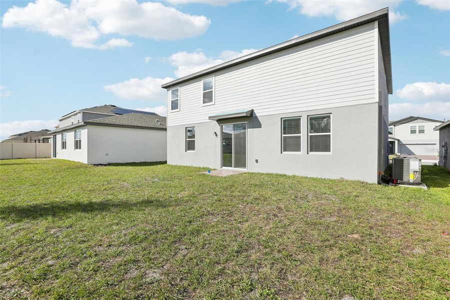 Exterior details and patio area of a home in Lawson Dunes - Signature Series, Haines City (Image 28).