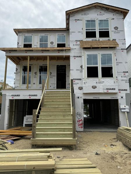 Front exterior of a new home in Oak Bluff, Charleston, SC, highlighting curb appeal (Image 2). Front exterior of a new home in Oak Bluff, Charleston, SC, highlighting curb appeal (Image 2).