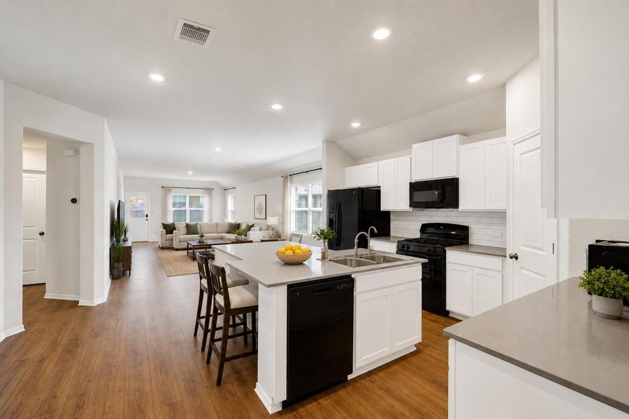 An open-concept layout unites the well-appointed kitchen with the inviting living area.